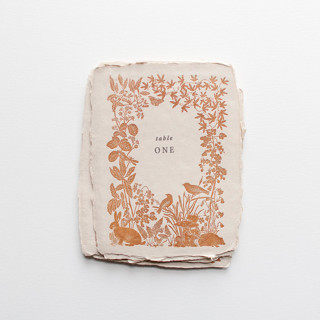 This is a brown table numbers by Tara Grangroth called woodland florals letterpress table numbers in standard
