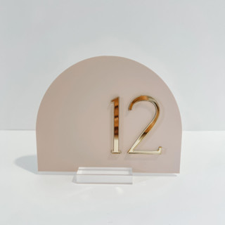 This is a gold table numbers by Alexandra Ettis called arch acrylic table number in standard