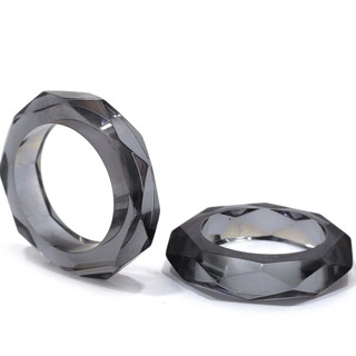 This is a black wedding decor by borrowed BLU called prism napkin rings // set of 4 in charcoal in standard