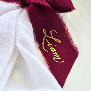 This is a red wedding decor by Inkspiringletters called personalized hand-written and hand-foiled fringed wine red chiffon ribbon- set of 10 in standard