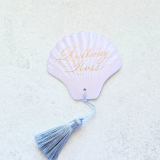 This is a white wedding place cards by Inkspiringletters called white watercolor seashell place card with blue tassel- personalized with calligraphy- set of 10 in standard