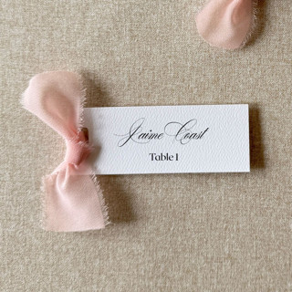 This is a pink wedding place cards by Cotton and Bow called slim place cards with blush pink bow | set of 10 | custom text in standard