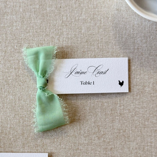 This is a green wedding place cards by Cotton and Bow called slim place cards with sage green bow | set of 10 | custom text in standard