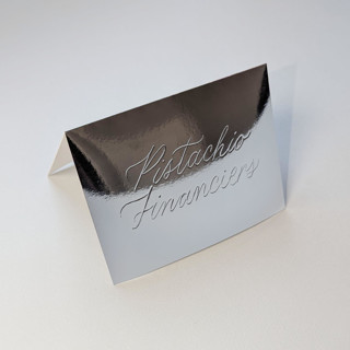 This is a silver wedding place cards by Sam Dubeau called hand debossed place card, buffet card | silver chrome tent style with full name, 2-4 words in standard