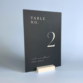 This is a white place card holders by Corduroy Effect called white rectangle table number holder, set of 5 in standard
