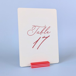 This is a red place card holders by Corduroy Effect called striped rectangle table number holder, pink and red, set of 5 in standard