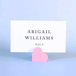 This is a pink place card holders by Corduroy Effect called pink heart place card holders, set of 10 in standard