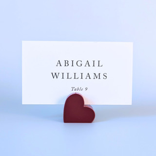 This is a red place card holders by Corduroy Effect called cranberry heart place card holders, set of 10 in standard