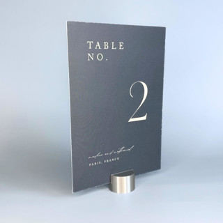 This is a silver place card holders by Corduroy Effect called silver color circle table number holder, set of 5 in standard