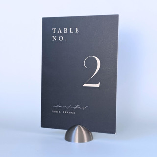 This is a silver place card holders by Corduroy Effect called silver color dome table number holders, set of 5 in standard