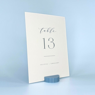This is a blue place card holders by Corduroy Effect called dusty blue round table number holder, set of 5 in standard