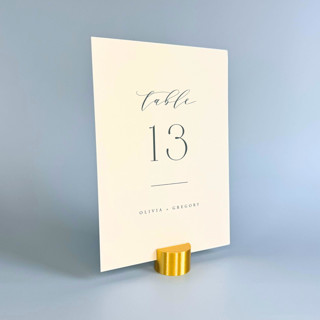 This is a gold place card holders by Corduroy Effect called gold color circle table number holder, set of 5 in standard