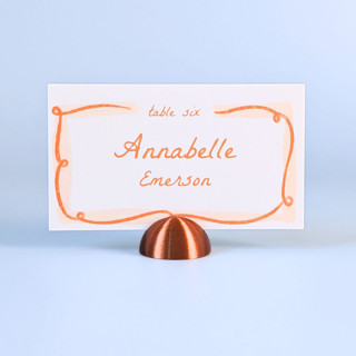This is a copper place card holders by Corduroy Effect called copper color dome place card holders, set of 25 in standard