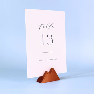 This is a copper place card holders by Corduroy Effect called copper color mountain table number holder, set of 5 in standard