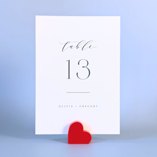 This is a red place card holders by Corduroy Effect called red heart table number holders, set of 5 in standard