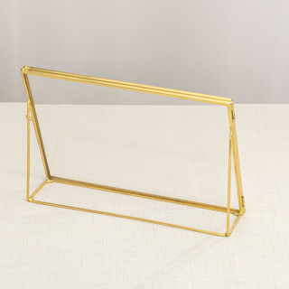 This is a gold place card holders by Lea Li called brass and glass gold horizontal 6x8" card holder in standard