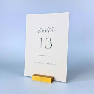 This is a gold place card holders by Corduroy Effect called personalized gold color rectangle table number holders, set of 5 in standard