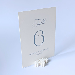 This is a white place card holders by Corduroy Effect called snowflake table number holders, set of 5 in standard