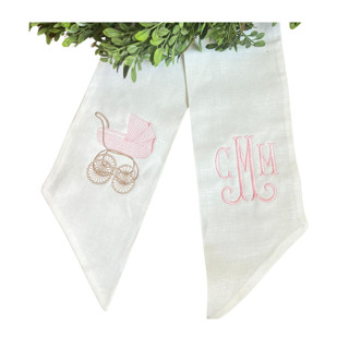 This is a white holiday decorations by Virginia Marcello called custom embroidered baby carriage wreath sash with monogram in standard