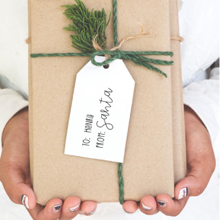 This is a multicolorassorted-colors wedding stationery by The Homebody Society called santa stamp for christmas gift tags personalized with your child's name in standard