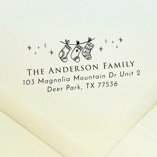 This is a black address labels by Samantha Malvey called christmas stockings address stamp | self inking return address stamp in standard