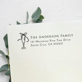 This is a black address labels by Samantha Malvey called bow drink address stamp | self inking return address stamp in standard