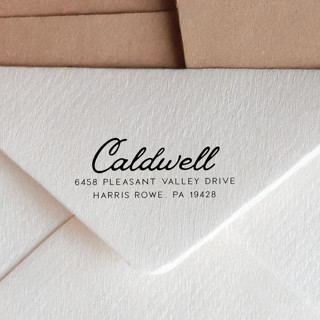 This is a black address labels by Sara Luke called retro script address stamp with a vintage look | self-inking in standard