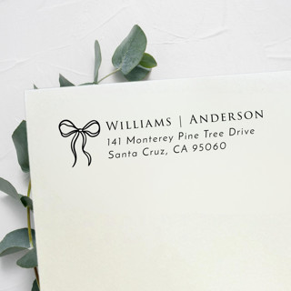 This is a black address labels by Samantha Malvey called wavy bow stamp | self inking return address stamp in standard