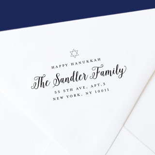 This is a black address labels by The Homebody Society called happy hanukkah self-inking address stamp in standard