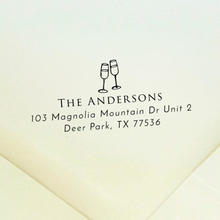 This is a black address labels by Samantha Malvey called champagne glasses address stamp | self inking return address stamp in standard
