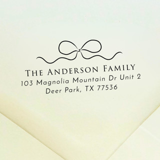 This is a black address labels by Samantha Malvey called bow address stamp | self inking return address stamp in standard