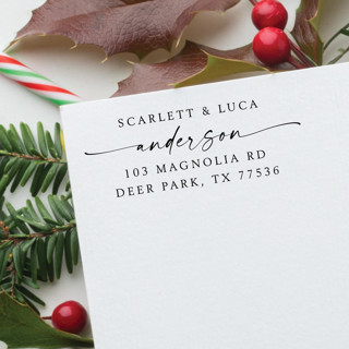 This is a black address labels by Samantha Malvey called couple names holiday stamp | self inking return address stamp in standard