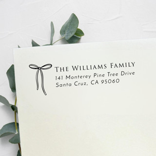 This is a black address labels by Samantha Malvey called string bow stamp | self inking return address stamp in standard