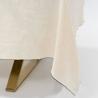 This is a beige wedding decor by borrowed BLU called stone washed linen tablecloth in standard