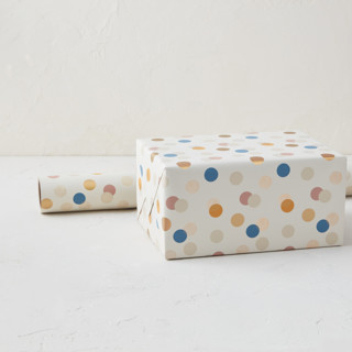 This is a cream wrapping paper by Sumak Studio called festive dots in standard