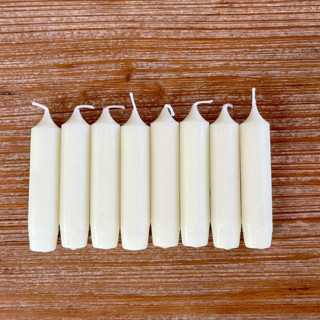 This is a white holiday decorations by Ann Nygard called dripless taper candles: 4" ivory unscented, set of 8 in standard
