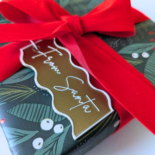 This is a brass gift tags by Corduroy Effect called from santa gift tags, set of 2 in standard