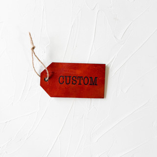 This is a brown gift tags by Left Grain called personalized leather gift tag, set of 4 in standard