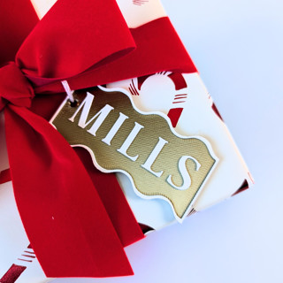 This is a brass gift tags by Corduroy Effect called personalized swiggle gift tag in standard